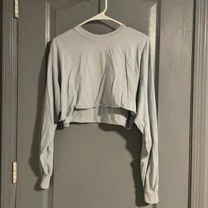 Cropped, long sleeve shirt.